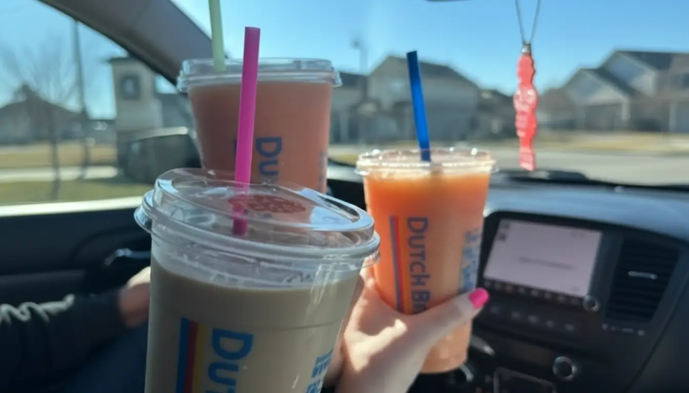 7 Brew vs Dutch Bros drinks placed in car cup holders showing real drive-thru coffee experience